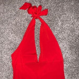 Beautiful floor length dress with a slit, open back, tie up around neck